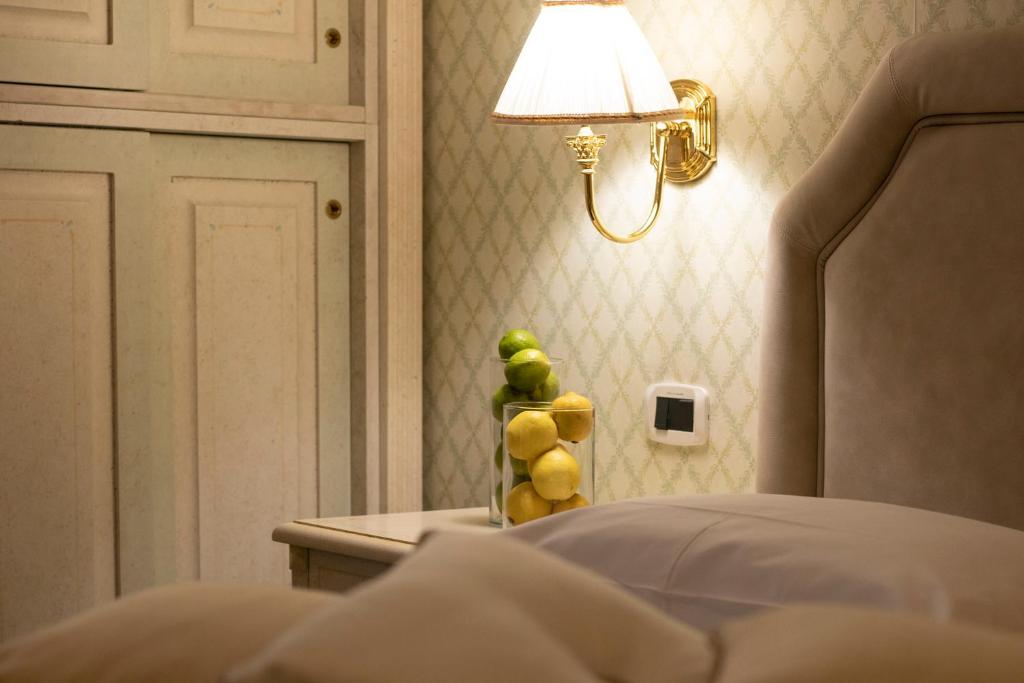 Postel nebo postele na pokoji v ubytování Hotel La Locanda