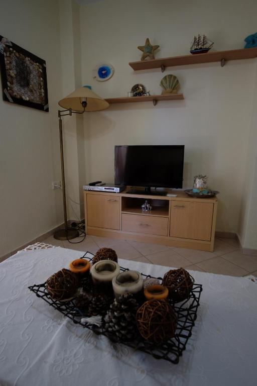 Televízia a/alebo spoločenská miestnosť v ubytovaní Billias House