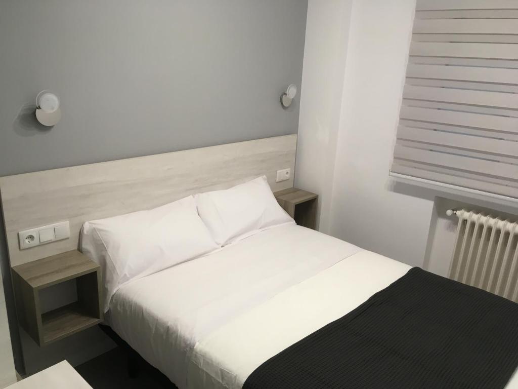 Postel nebo postele na pokoji v ubytování Hostal I Dream Salamanca