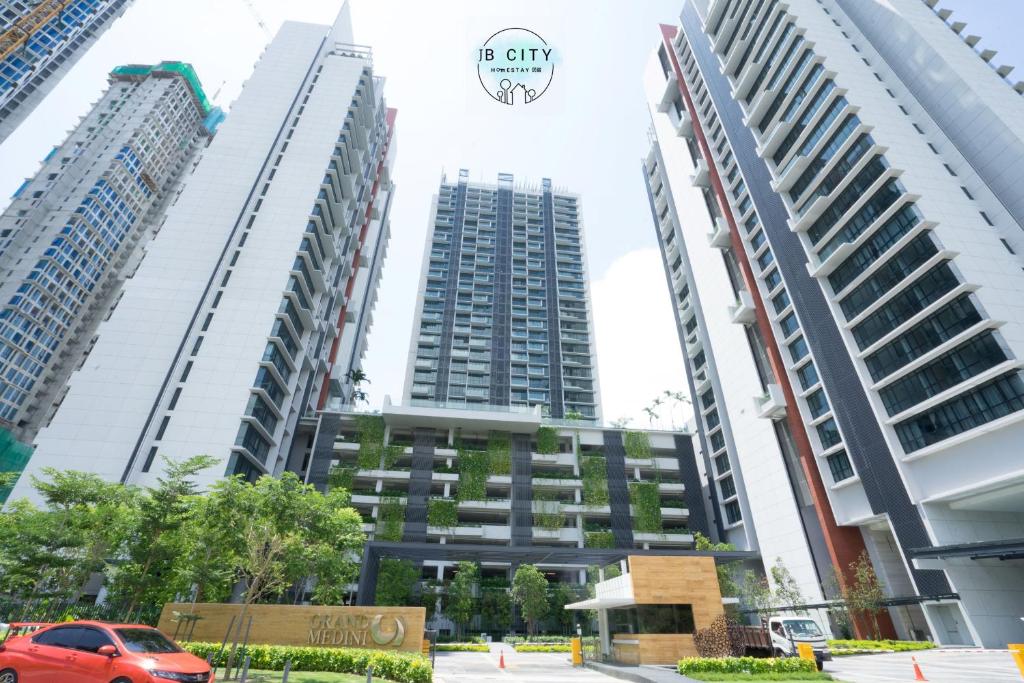 a group of tall buildings in a city at Grand Medini Suites by JBcity Home in Nusajaya