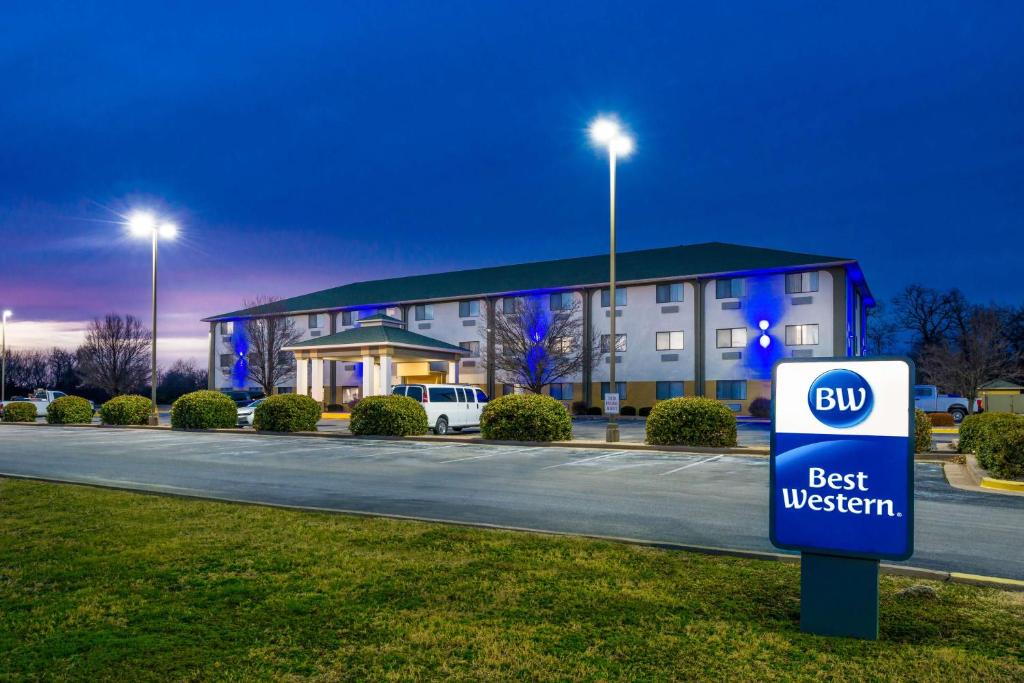 a best western building with a sign in front of it at Best Western Big Spring Lodge in Neosho