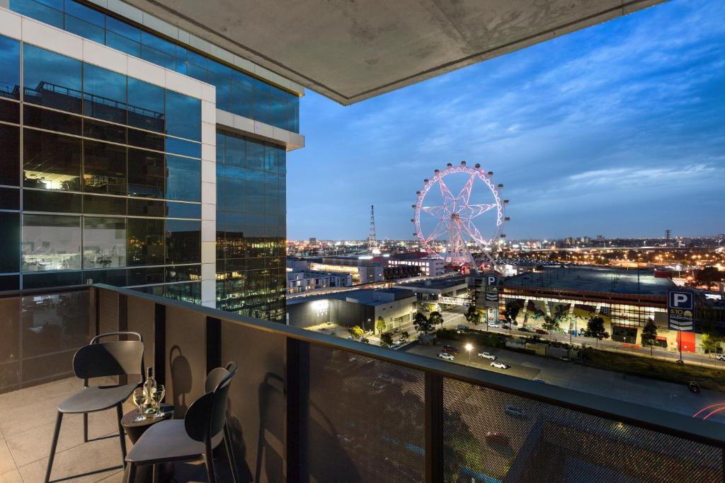 a view of the london eye from the balcony of a building at Quest NewQuay in Melbourne