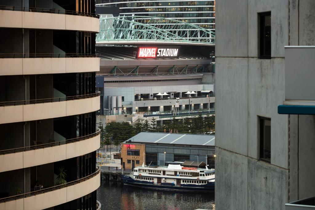 a view of a river between two tall buildings at Quest NewQuay in Melbourne