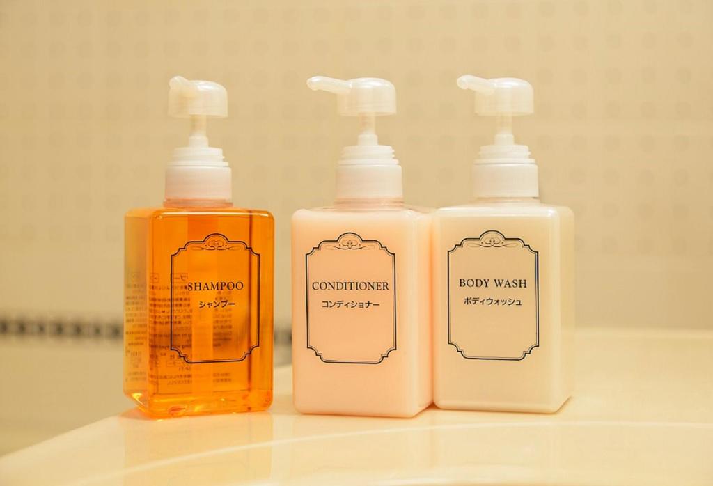 three bottles of soap sitting on top of a bathroom counter at Rihga Royal Hotel Hiroshima in Hiroshima