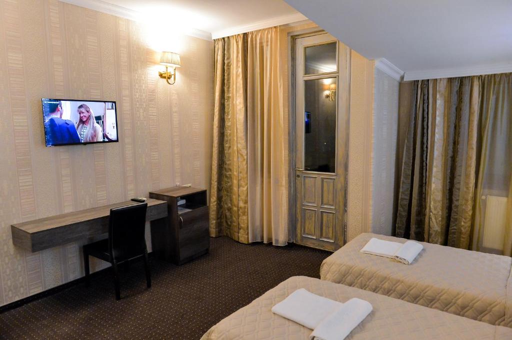 TV a/nebo společenská místnost v ubytování Hotel Old Town