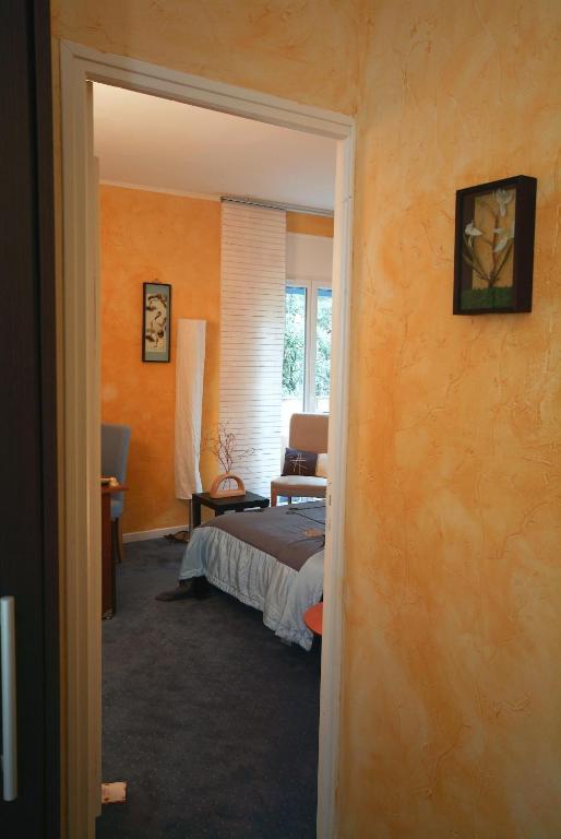 Un ou plusieurs lits dans un hébergement de l'établissement Cit'Hotel Le Mirage