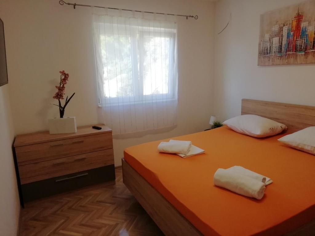 Postel nebo postele na pokoji v ubytování Apartman Marica