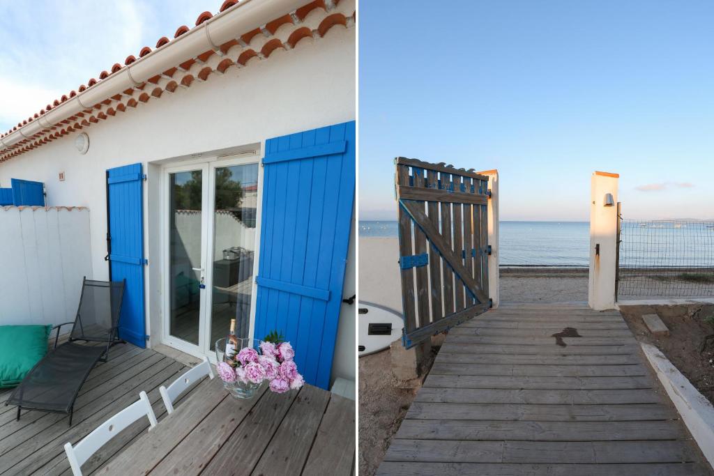 une maison avec une porte bleue sur la plage dans l'établissement APPARTEMENT 6 PERSONNES VUE MER 30 M DE LA PLAGE, à Hyères