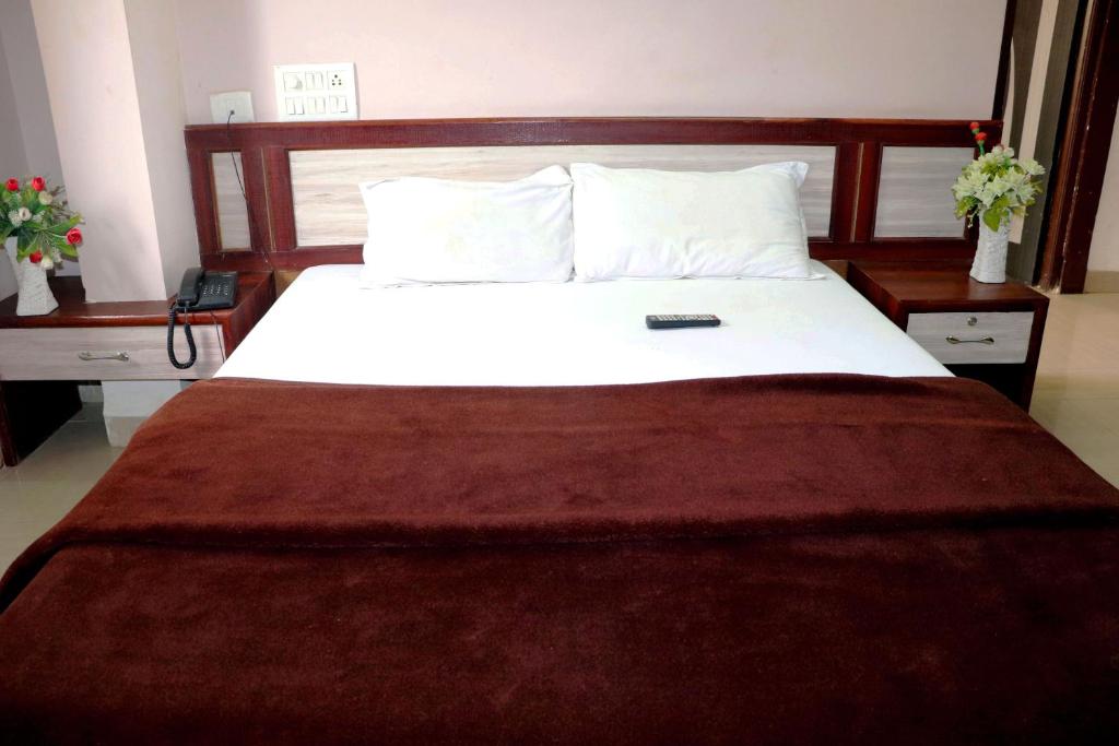 Postel nebo postele na pokoji v ubytování Hotel Raj Palace