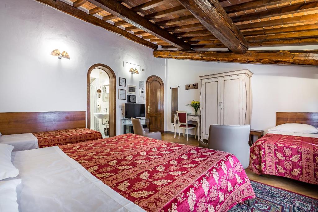 Postel nebo postele na pokoji v ubytování Hotel Collodi Firenze