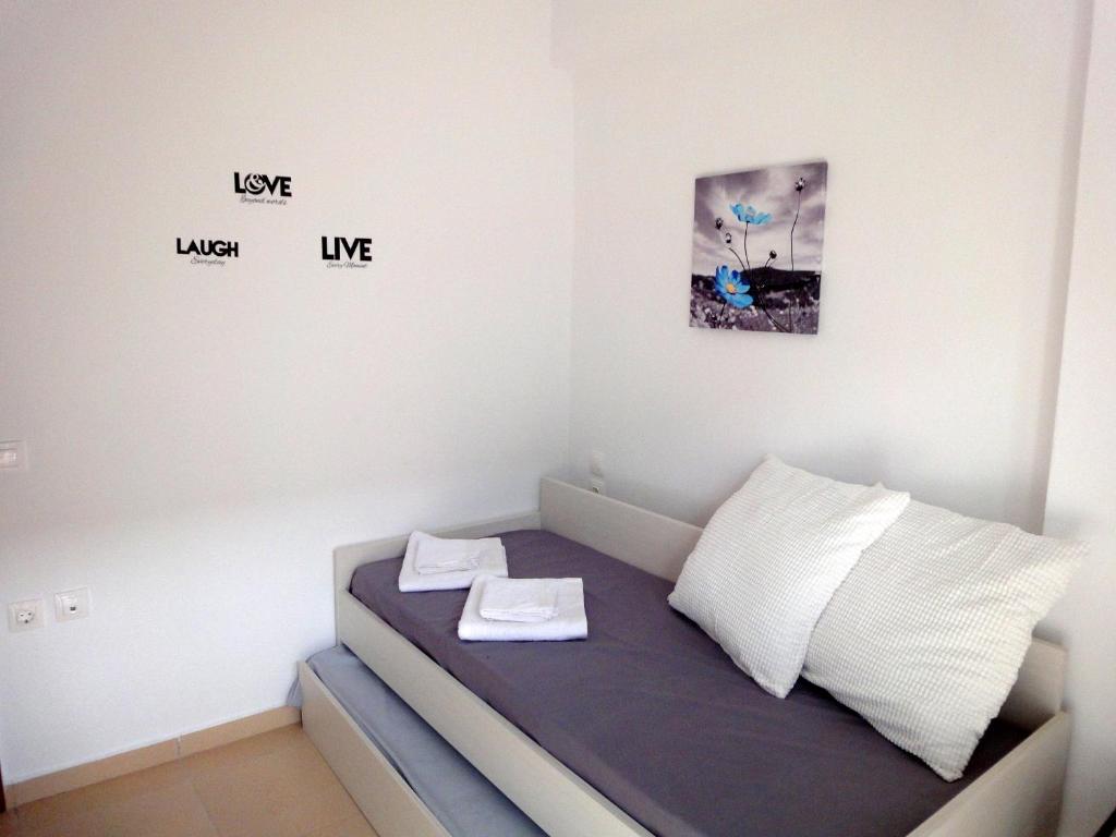 Posteľ alebo postele v izbe v ubytovaní Polychrono Nikos Apartment