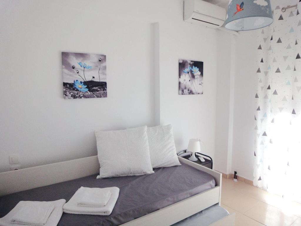 Posteľ alebo postele v izbe v ubytovaní Polychrono Nikos Apartment