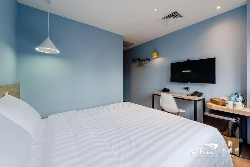 Postel nebo postele na pokoji v ubytování Prince Hotel