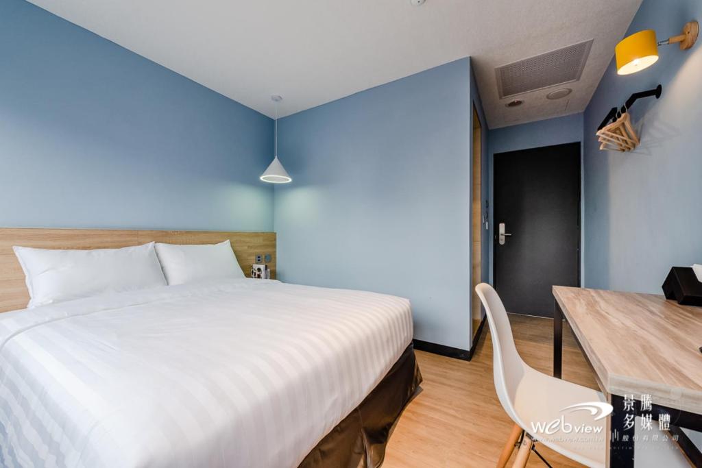 Postel nebo postele na pokoji v ubytování Prince Hotel
