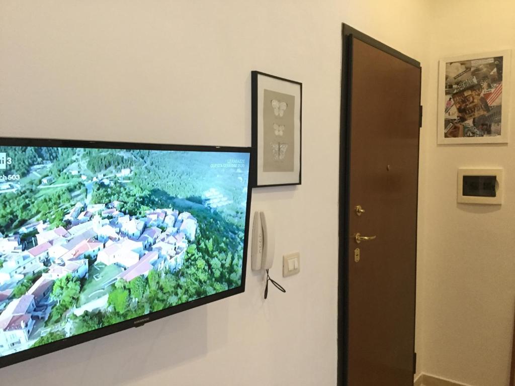 Televízia a/alebo spoločenská miestnosť v ubytovaní New Alex Home. Al Teatro.