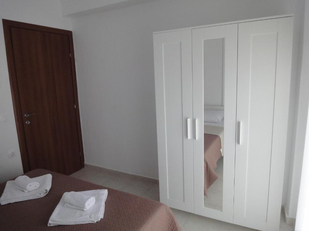 Posteľ alebo postele v izbe v ubytovaní Polychrono Nikos Apartment