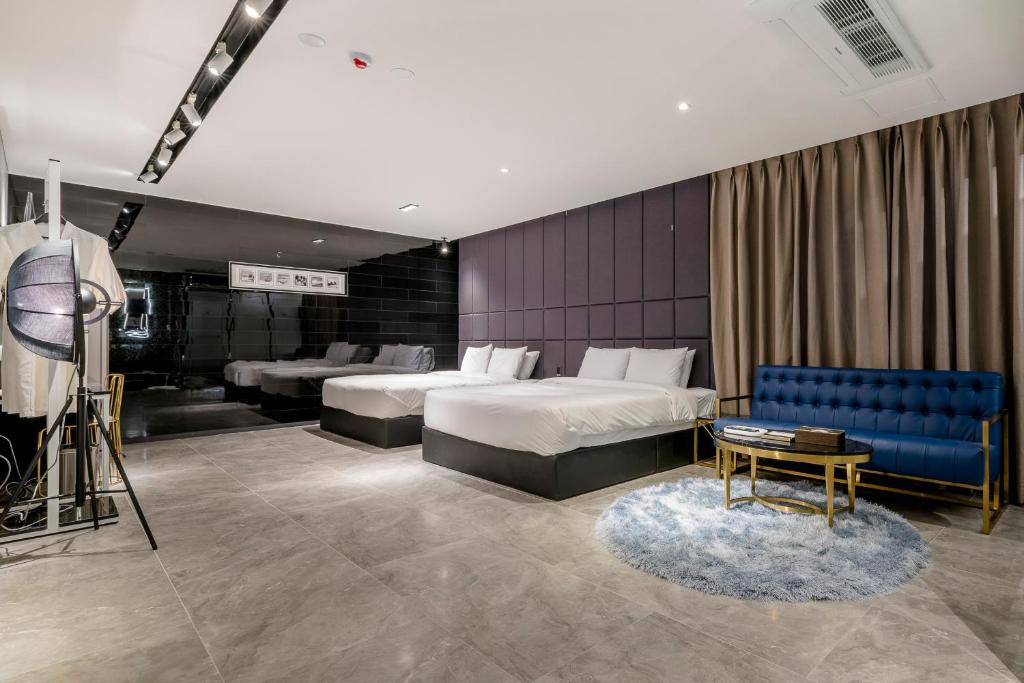 Postel nebo postele na pokoji v ubytování Air Sky Hotel