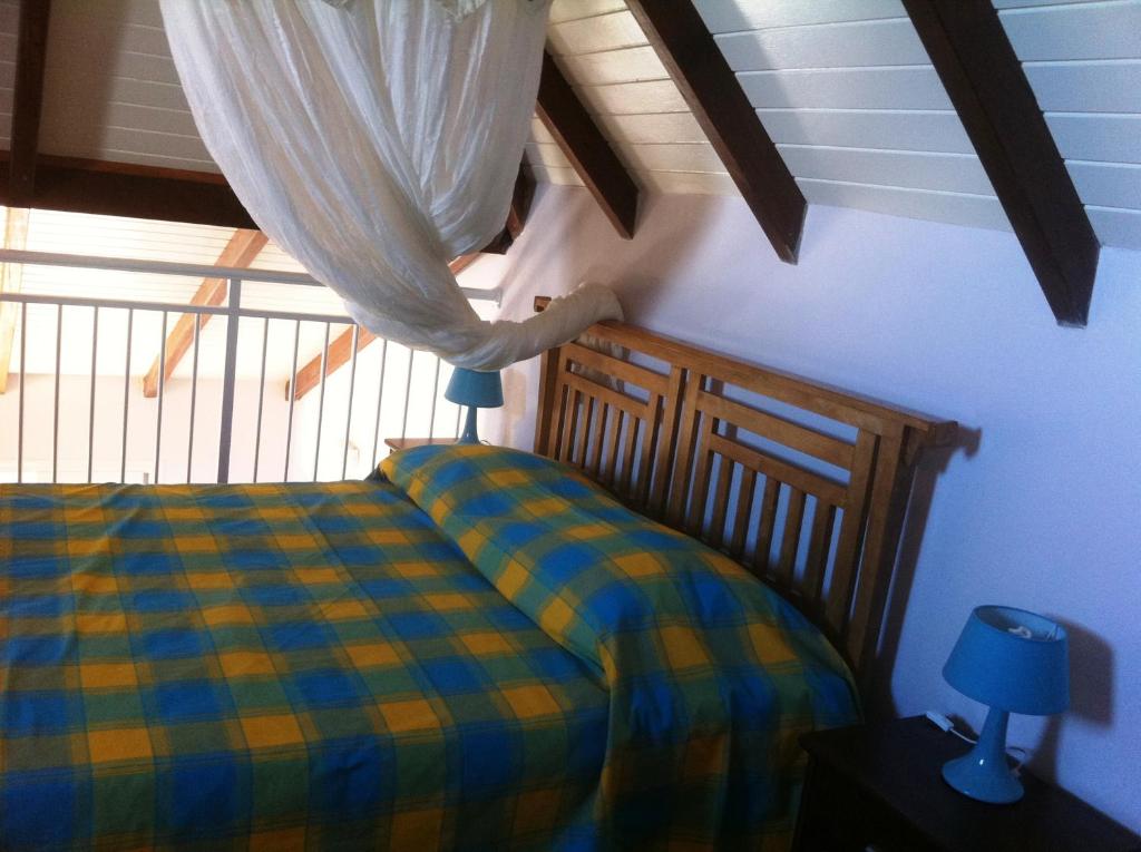 Postel nebo postele na pokoji v ubytování Coco D'Iles