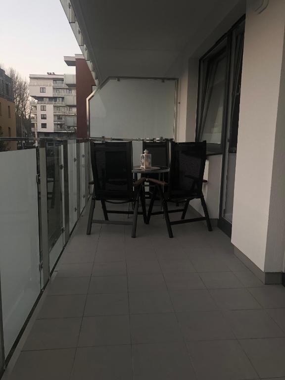 Balkón alebo terasa v ubytovaní APARTAMENT BLIŻEJ MORZA Sorrento z garażem