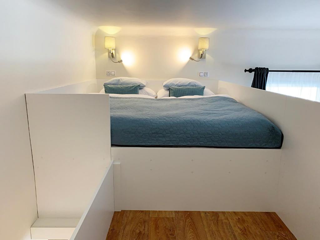 Łóżko lub łóżka w pokoju w obiekcie Marienbad Apartment