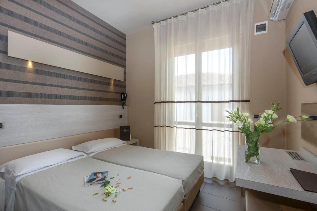 Postel nebo postele na pokoji v ubytování Hotel Rosenblatt