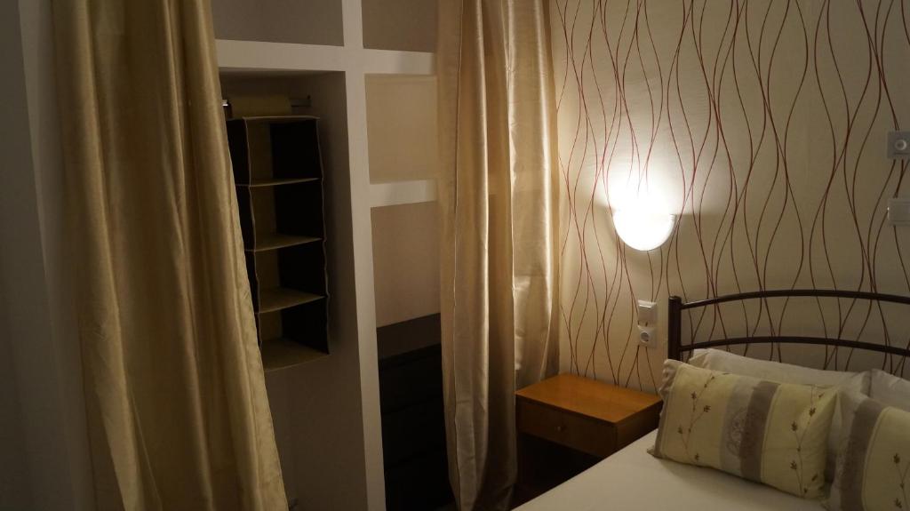 Postel nebo postele na pokoji v ubytování Possidi Kouslaka