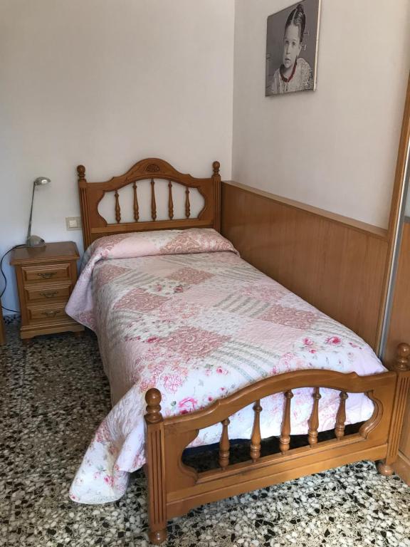A bed or beds in a room at "La Chacra" Casa Típica Valenciana