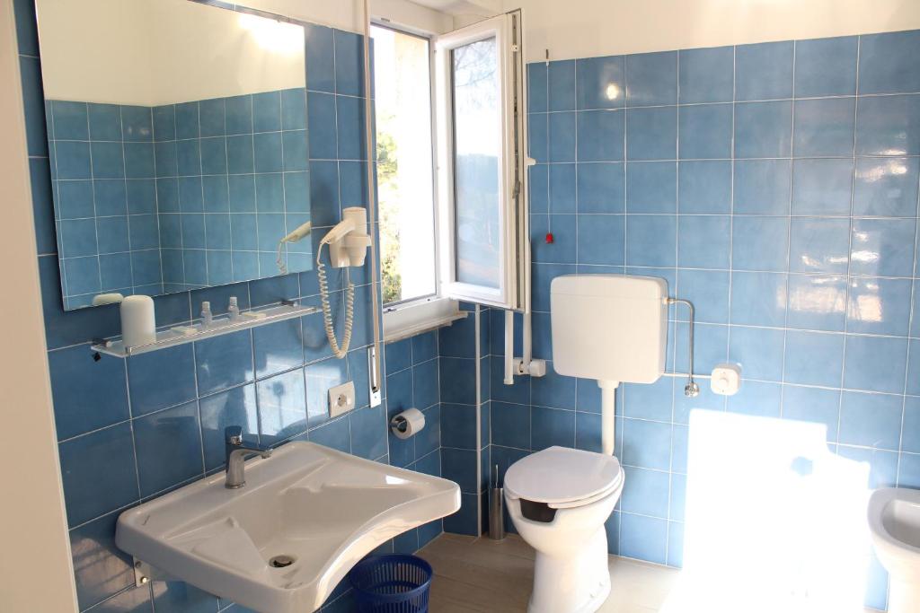 Koupelna v ubytování Hotel Luca
