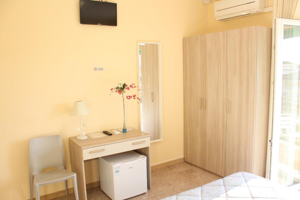 Postel nebo postele na pokoji v ubytování Hotel Luca