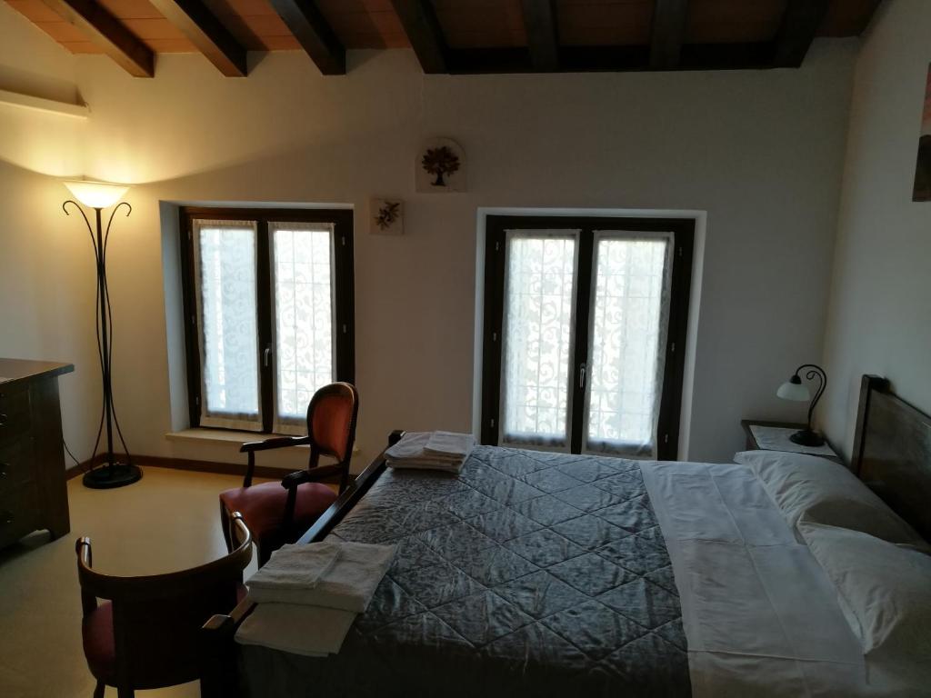 Postel nebo postele na pokoji v ubytování B&B L'Upupa