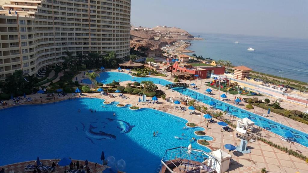 an aerial view of a swimming pool at a resort at Pyramids Porto Ain Sokhna in Ain Sokhna