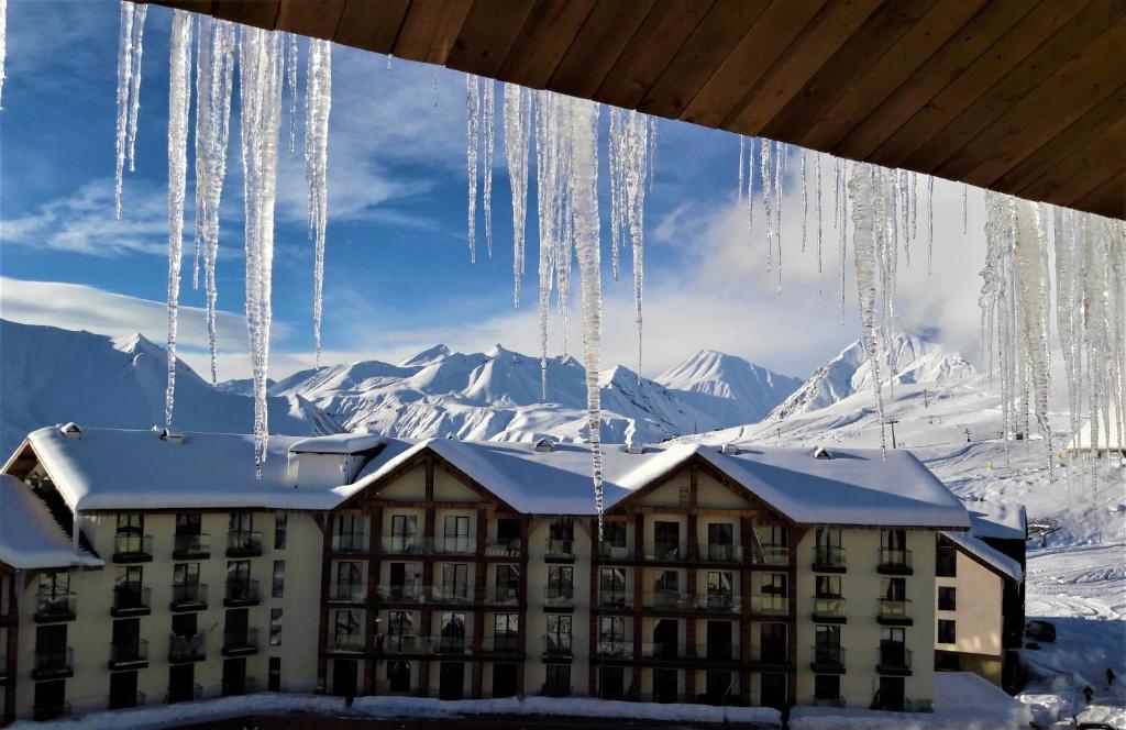 a large building with icicles hanging from the ceiling at New Gudauri Loft II studio 553 in Gudauri
