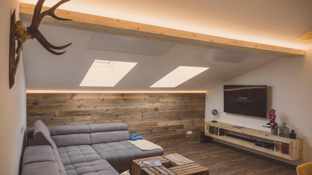 Televízia a/alebo spoločenská miestnosť v ubytovaní Apartment NinetyFour