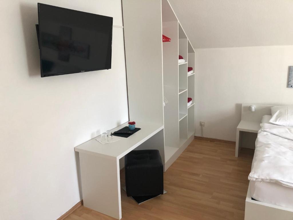 TV a/nebo společenská místnost v ubytování Center Rooms Villach