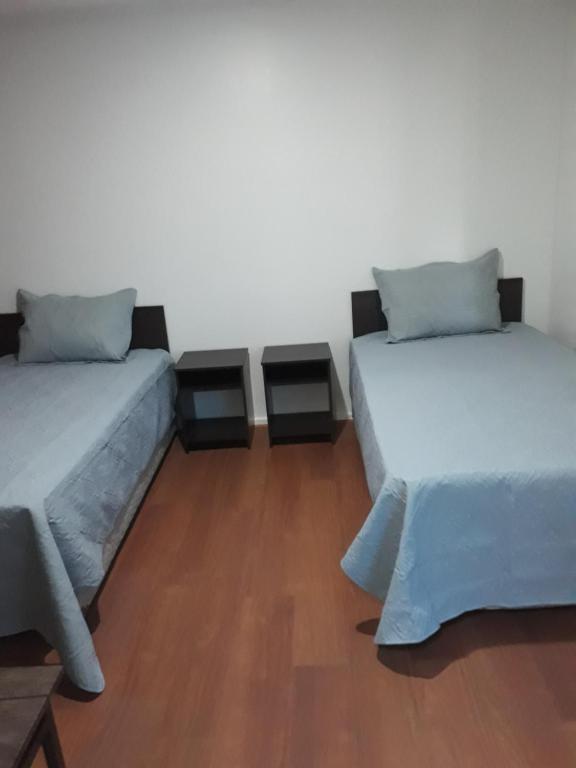 Postel nebo postele na pokoji v ubytování Hostal Alessandri