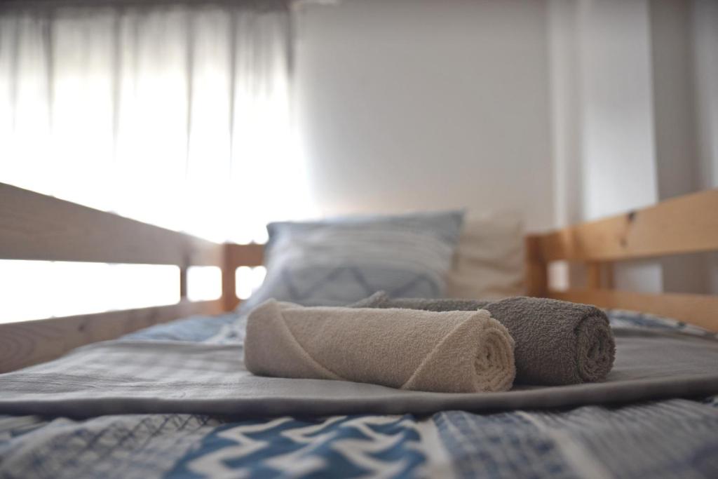 Postel nebo postele na pokoji v ubytování Surf House Peniche