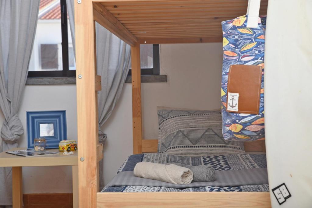 Postel nebo postele na pokoji v ubytování Surf House Peniche