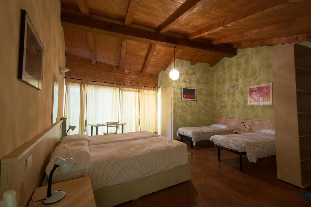 Postel nebo postele na pokoji v ubytování Massa Vecchia