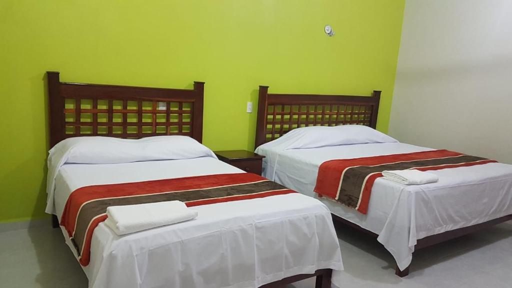 Postel nebo postele na pokoji v ubytování HOTEL VILLA CALAKMUL