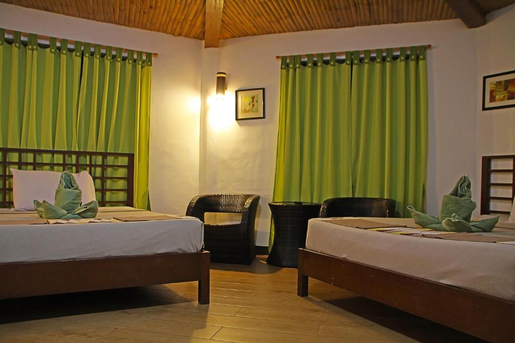 Postel nebo postele na pokoji v ubytování Coron Hilltop View Resort