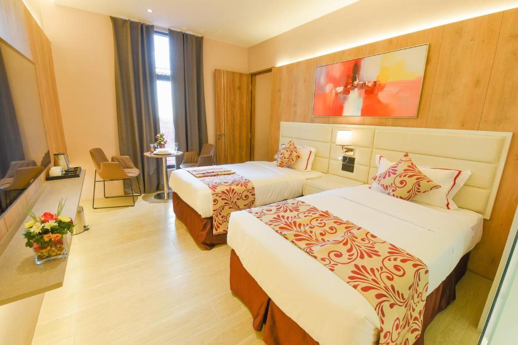 Postel nebo postele na pokoji v ubytování Red Hotel Cubao, Quezon City