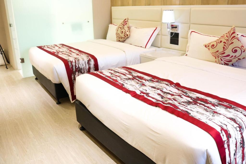 Postel nebo postele na pokoji v ubytování Red Hotel Cubao, Quezon City