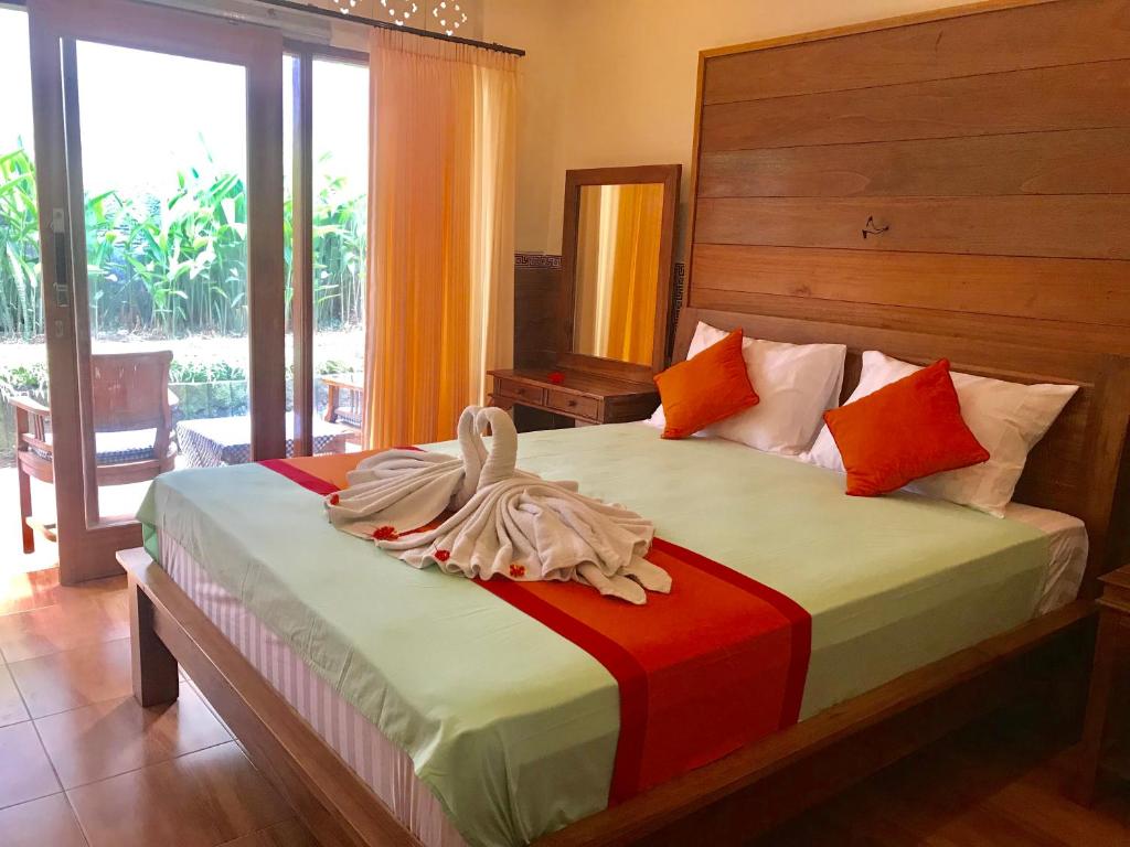 Postel nebo postele na pokoji v ubytování Sulendra Jungle Suites Ubud View by EPS