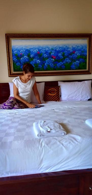 Postel nebo postele na pokoji v ubytování Ubud Taksu Homestay