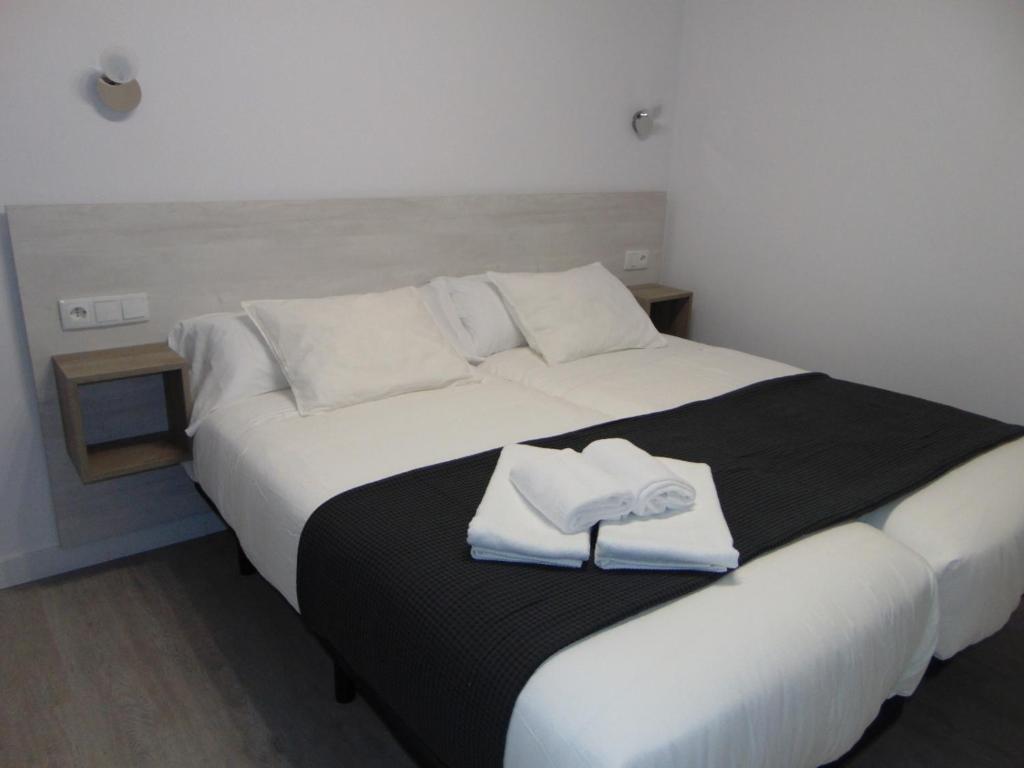 Postel nebo postele na pokoji v ubytování Hostal I Dream Salamanca