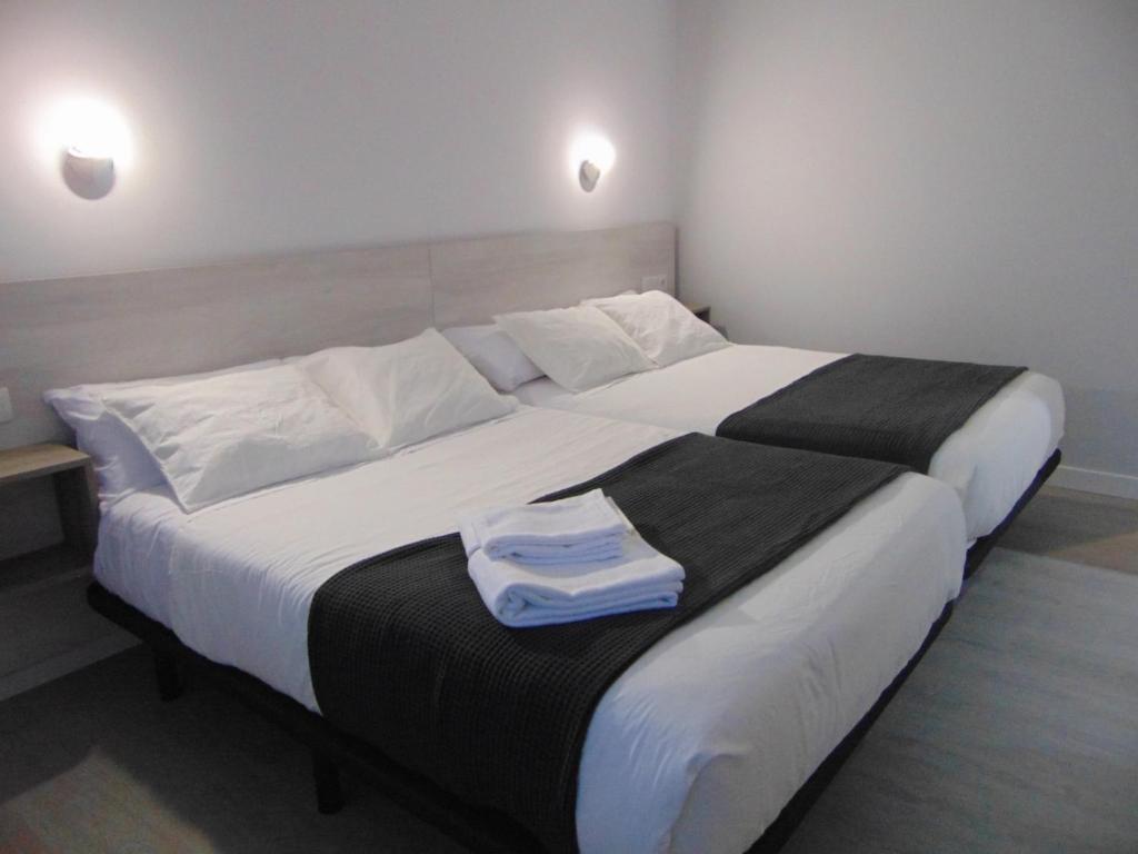 Postel nebo postele na pokoji v ubytování Hostal I Dream Salamanca