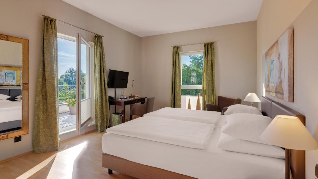Postel nebo postele na pokoji v ubytování Hotel Villa Medici