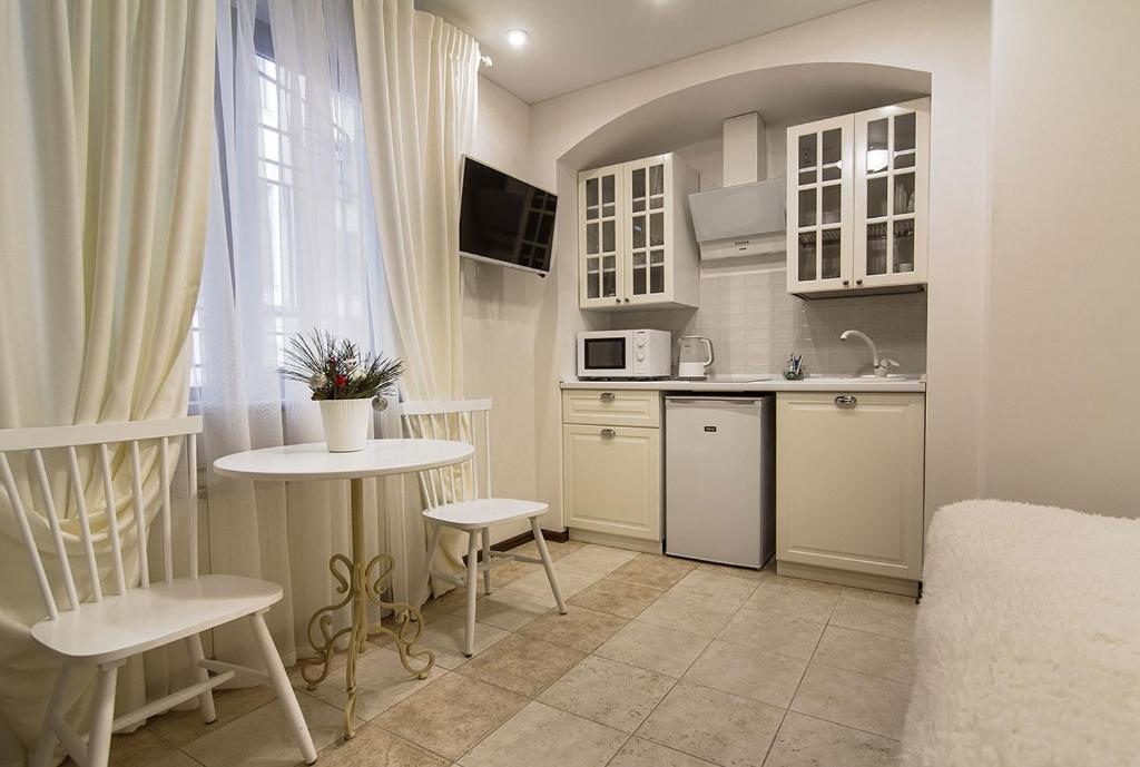 Kuchyň nebo kuchyňský kout v ubytování Apart Hotel Quartet