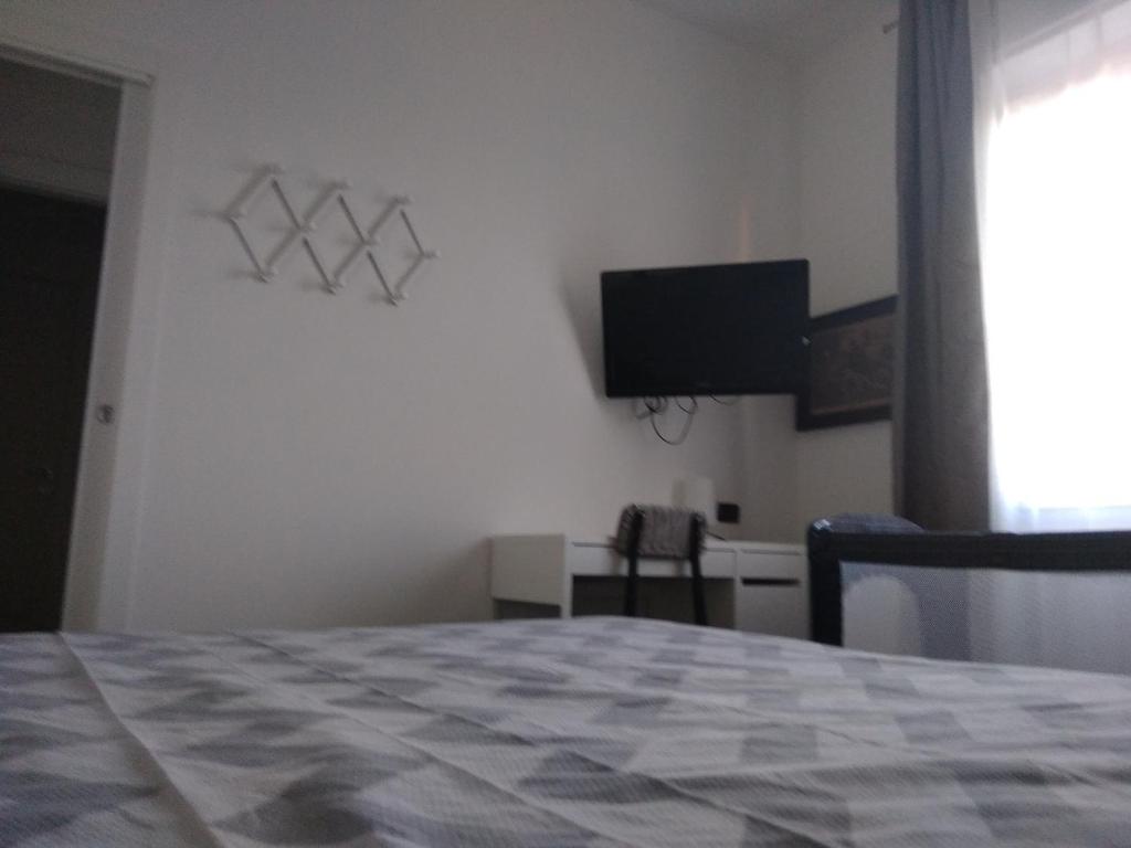 Телевизор и/или развлекательный центр в B&B Gaslini & Mare (anche con uso cucina)
