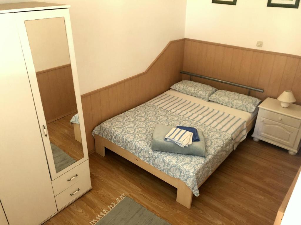 Postel nebo postele na pokoji v ubytování Guesthouse Vila Ruzmarin